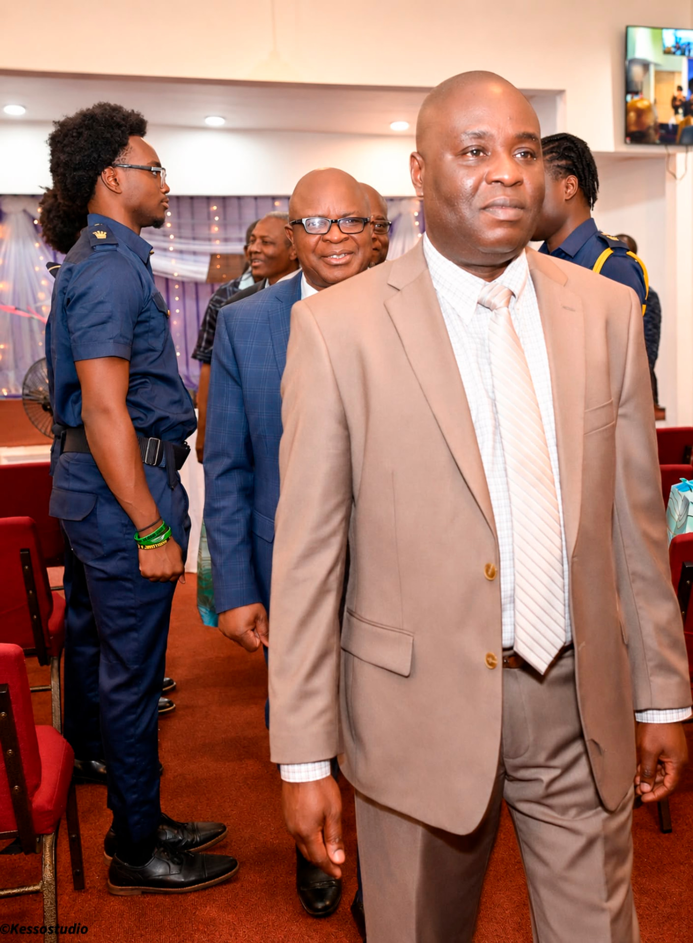 A brother walking in for the Men's Missionary Union service