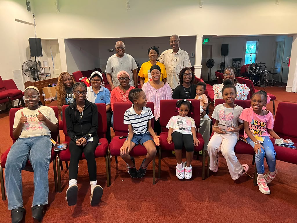 Children and their teachers after a Sunday service