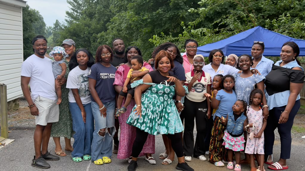 Members and their families greeting one another outside the church