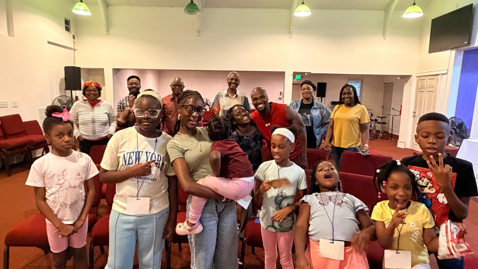 Children and teachers cheering at Vacation Bible School
